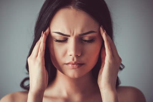 woman experiencing headache